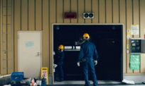 man standing in front of open doorway